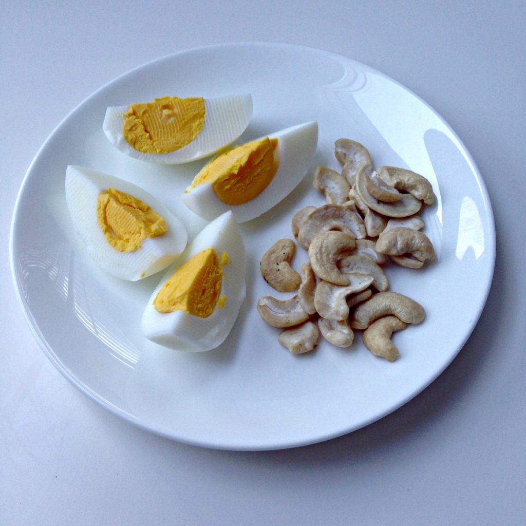 Hard-boiled eggs with nuts and sweet rolls
