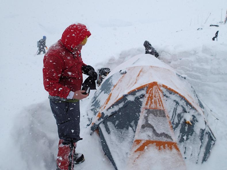 Remove the snow from the tent