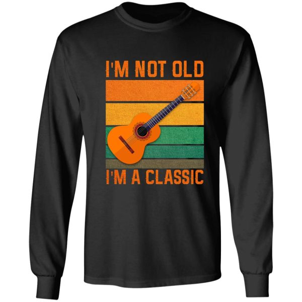 guitar player playing acoustic guitar long sleeve