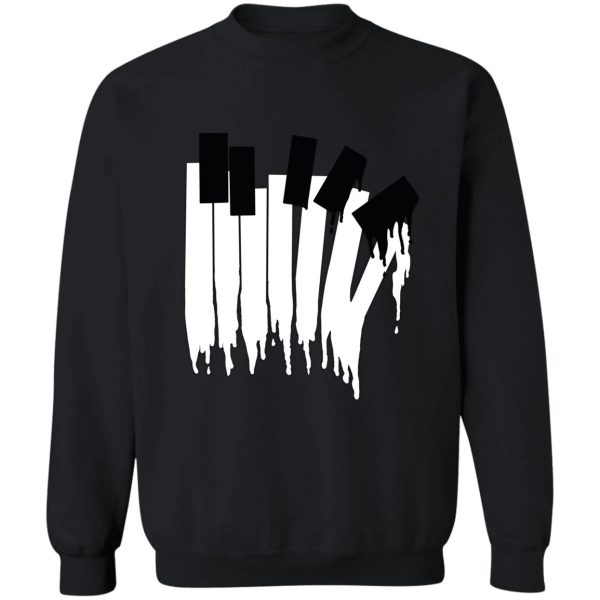 melting piano keys in aqua blue sweatshirt